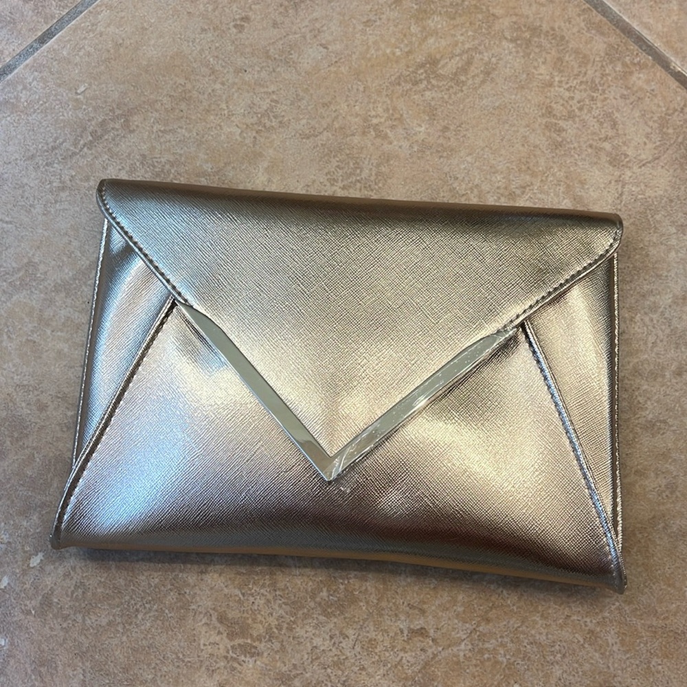 rose gold going out clutch, brand new, never worn